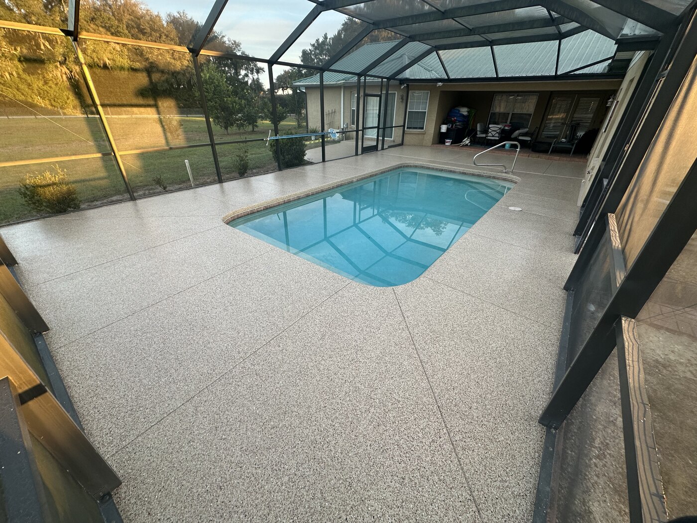 Epoxy flake coating on a screened pool deck, Line Flooring project