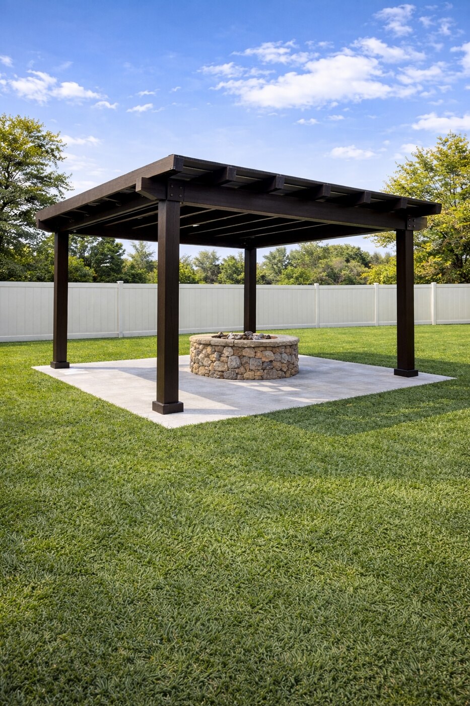Freestanding wood pergola over a paver patio with a stone fire pit