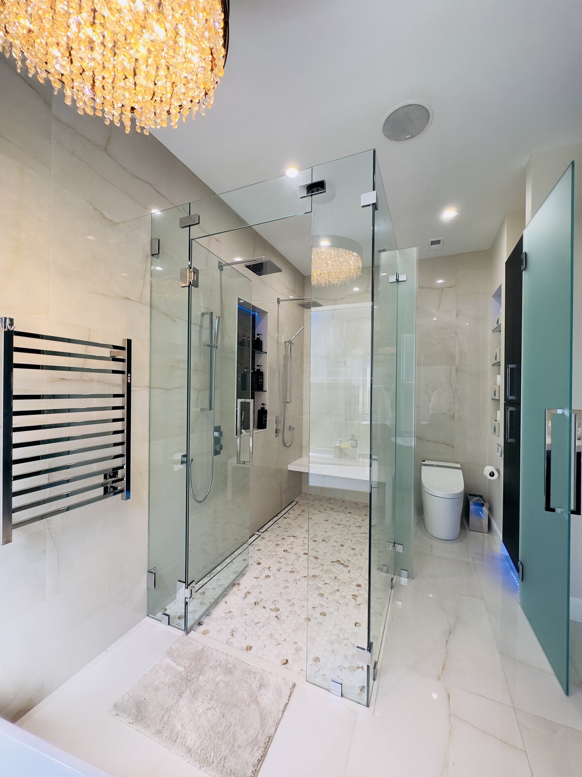 Freestanding soaking tub with marble tile flooring, bay window bathroom remodel by Line Flooring
