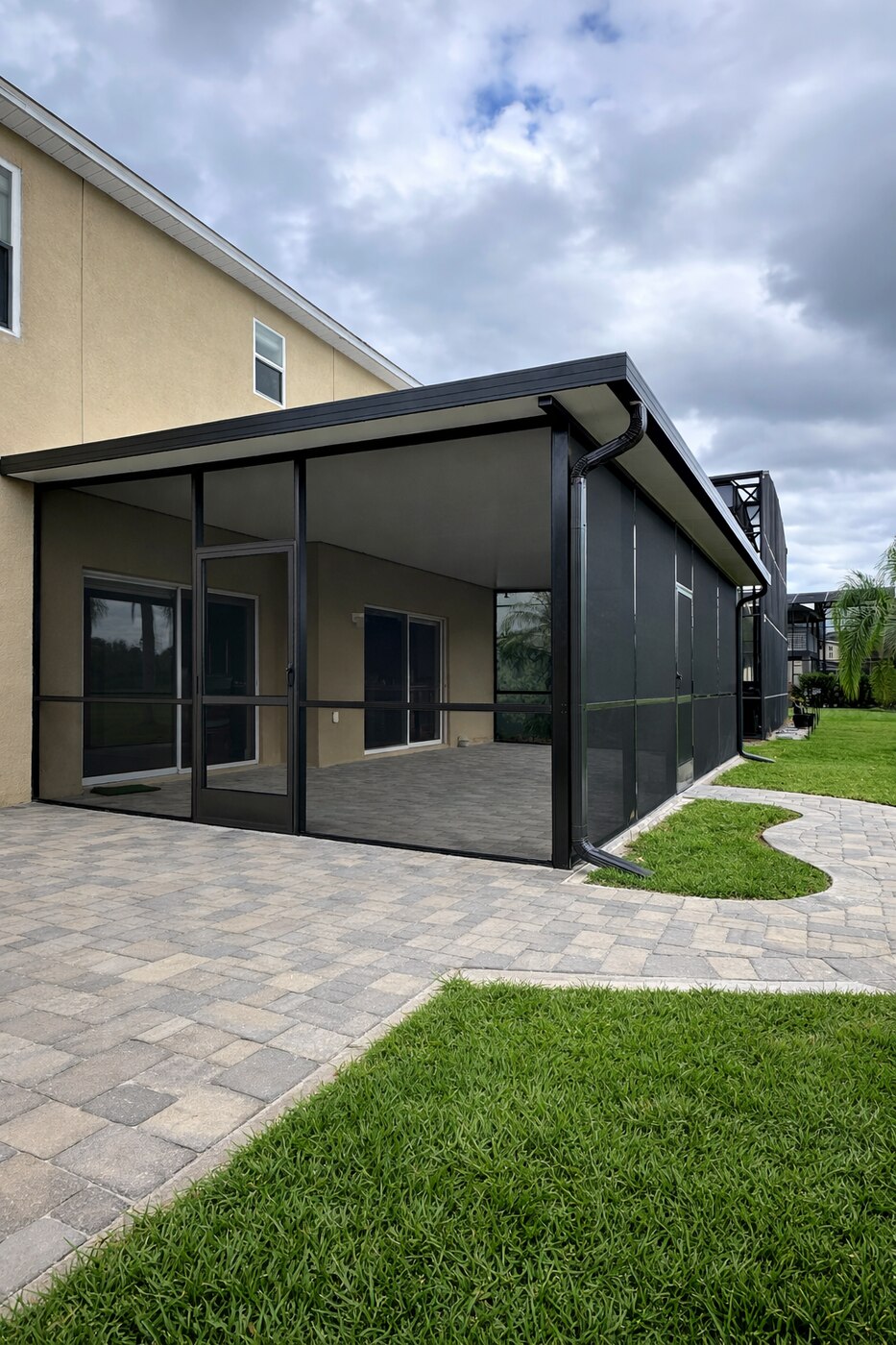 Aluminum screen room enclosure over a paver patio, Line Flooring project
