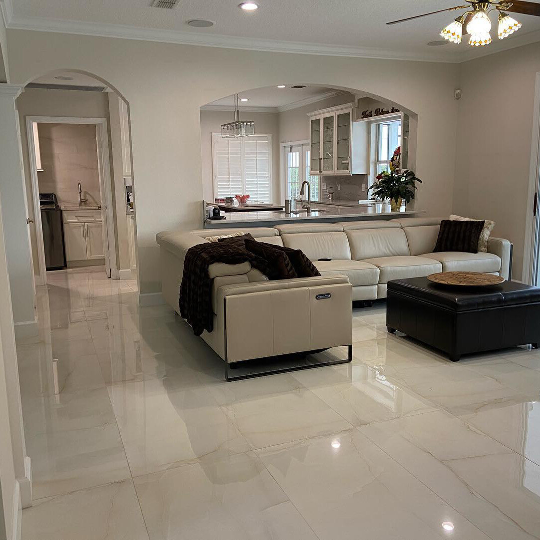 Large-format tile flooring in an open living and dining space, Line Flooring project
